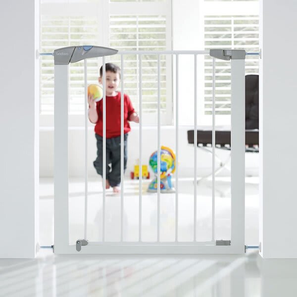 Child behind a baby gate.